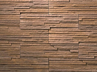 Jemne štruktúrovaný kamenný obklad v tmavohnedom prevedení s melírom. Obklad Láva Marrone